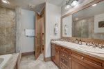 Master bathroom with dual sink vanity, separate tub and shower